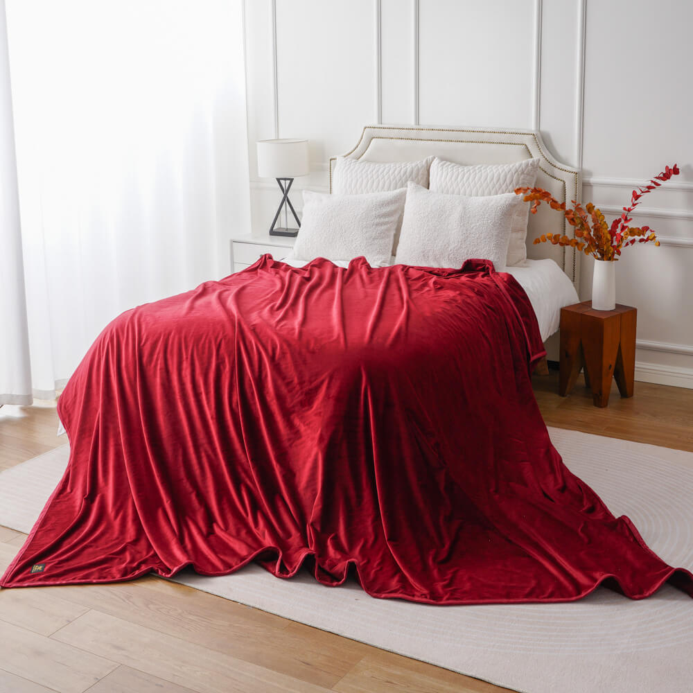 red-minky-blanket-bedroom-decor.jpg Red minky fleece blanket in cozy bedroom setting with white furniture