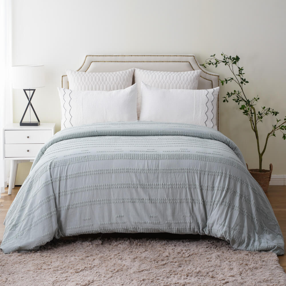 Full bedroom display of wholesale recycled tufted cotton linen duvet cover set in modern eco-friendly style.