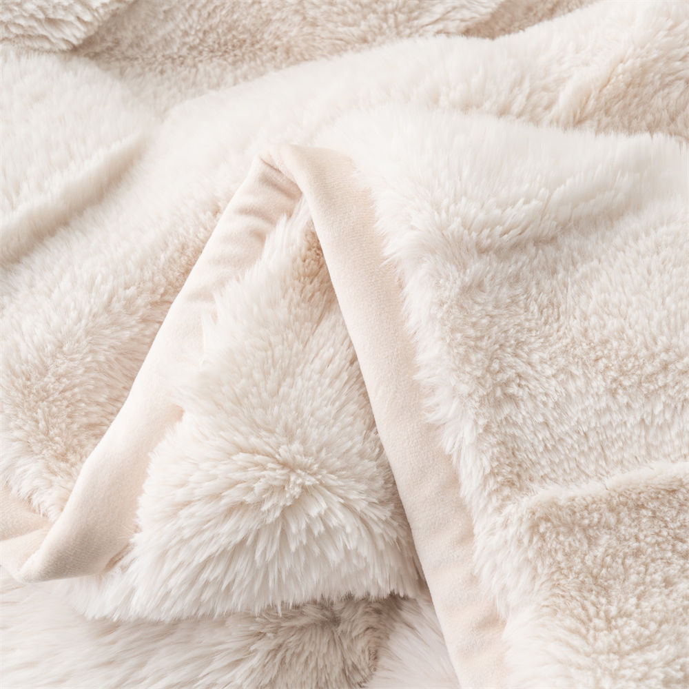 double sided checkered faux fur blanket 6 Detailed shot of the exquisite hemmed edge and soft reverse side of a ripple faux fur blanket for bulk order.