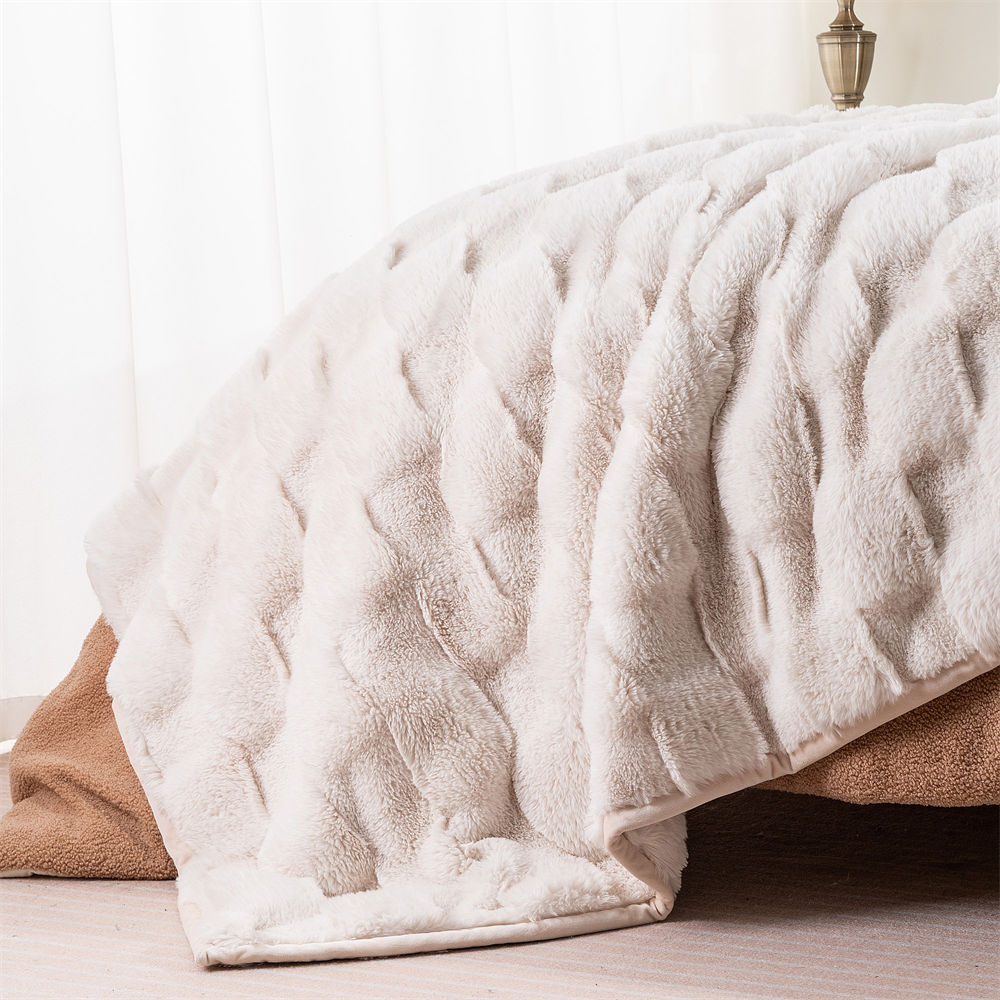 Plush ripple faux fur blanket used as a bed throw, suitable for home textile and bedding bulk buyers.