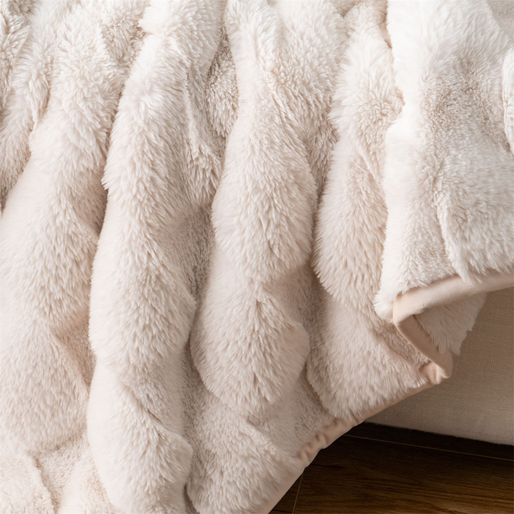 Close-up detail of the plush texture and ripple pattern on a double-sided faux fur blanket from home textile manufacturer.