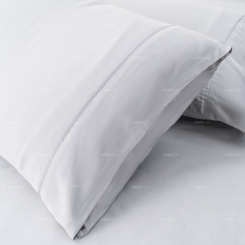 Close-up of the exquisite high-density stitching and clean hem craftsmanship on a grey bamboo pillowcase.