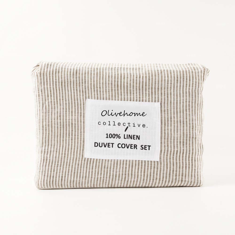 Front view of 100% linen duvet cover set neatly packaged with organic textile label, high-end home decor supplier bulk orders.