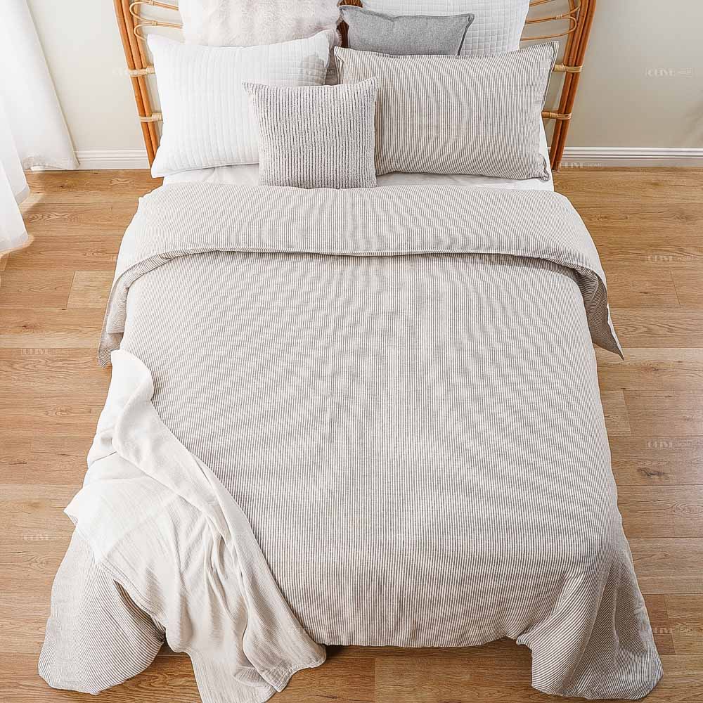 Top view of striped premium linen bedding set with duvet cover and pillowcases, high-quality linen comforter cover for bulk suppliers.