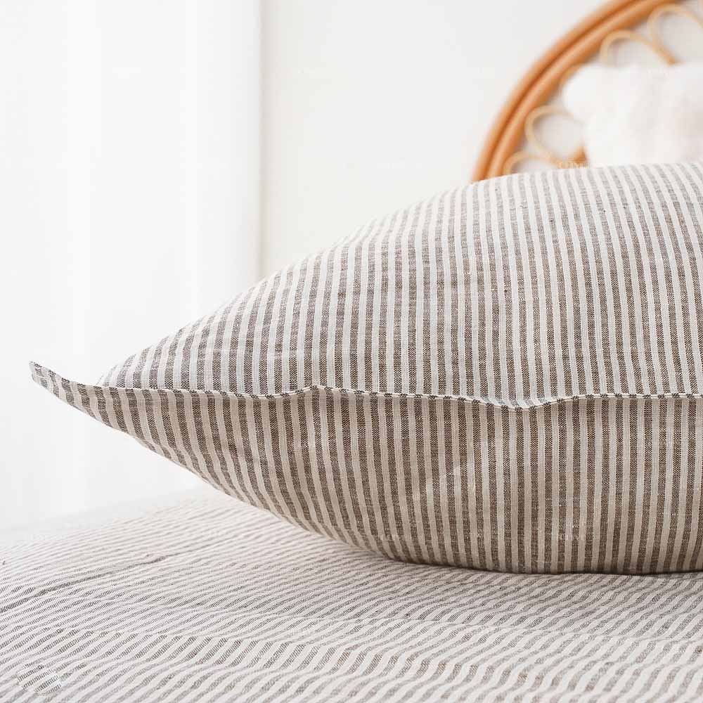 Close-up of a striped premium linen pillowcase with high-quality stitching, durable retail-ready bedding for B2B buyers.