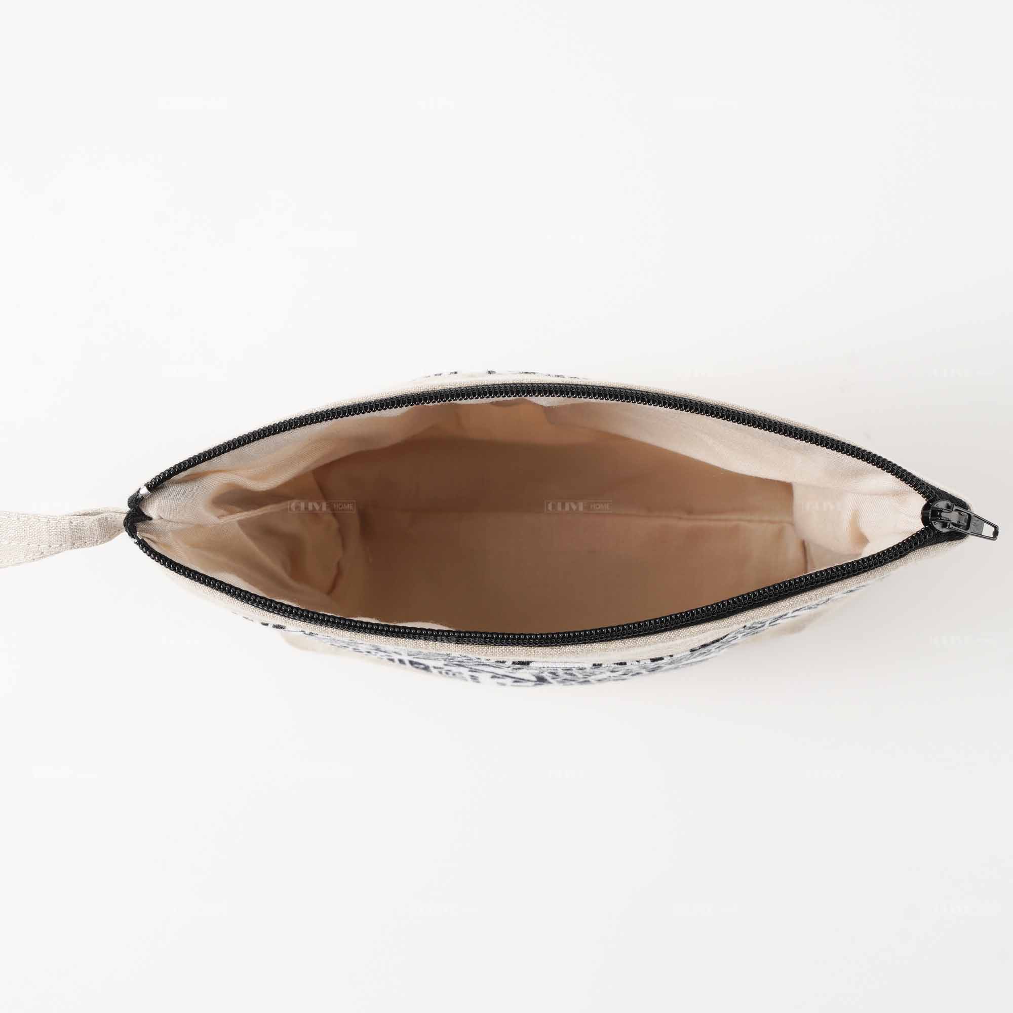 Top down view showing the spacious interior lining and wide opening of the linen clutch pouch.