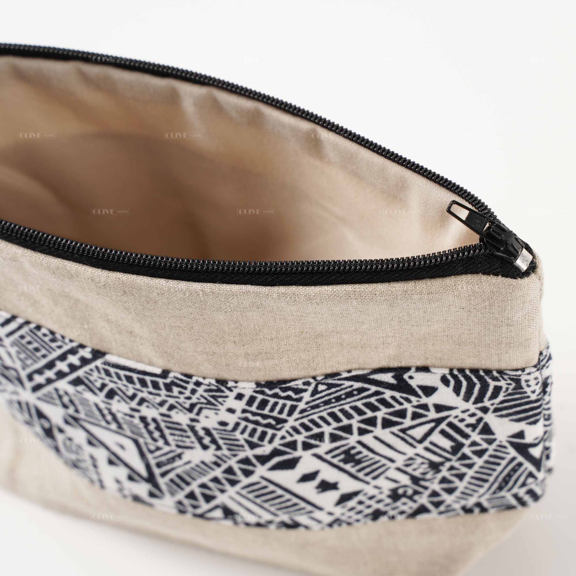 Close-up look at the durable black metal zipper and high-quality flax linen fabric texture.